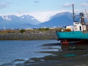 Beached barge and glacier in the east
